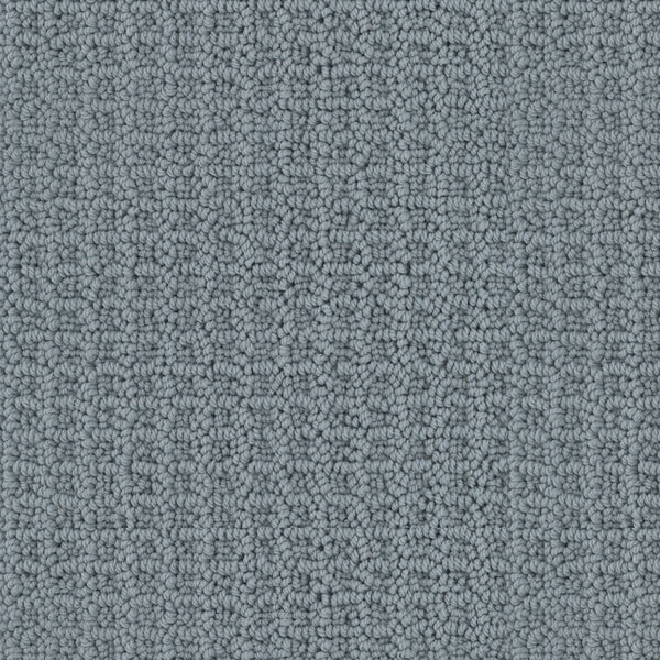 Close-up of the Seascape Berber Carpet in gray, featuring a textured loop-pile and subtle geometric pattern with tightly woven fibers for a soft, even surface.