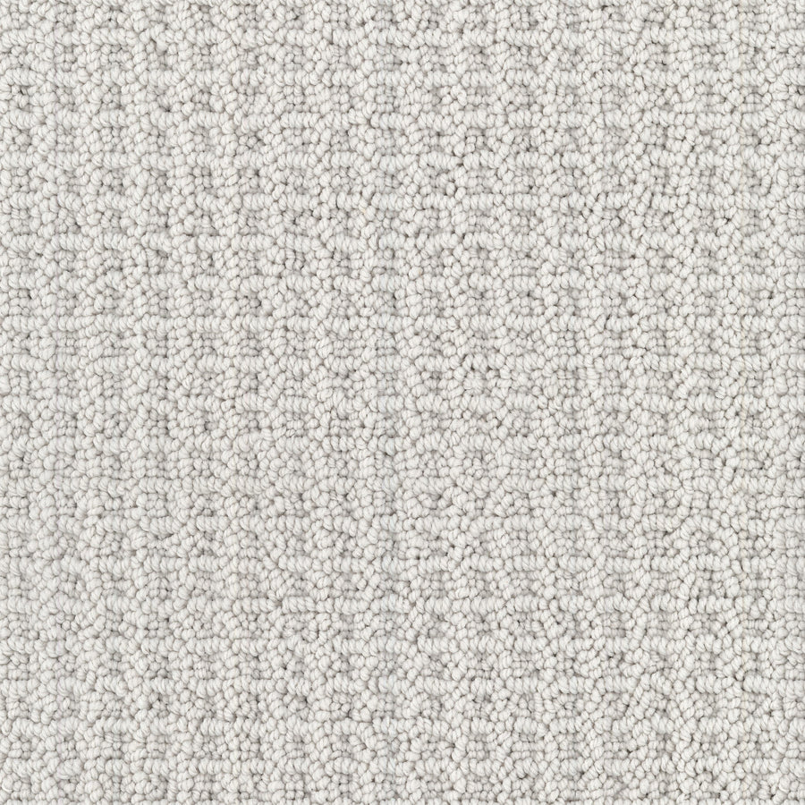 Close-up of Seascape Berber Carpet, a light grey, loop-textured carpet featuring tightly packed, small rounded loops made from durable Envision nylon for a soft and uniform surface pattern.
