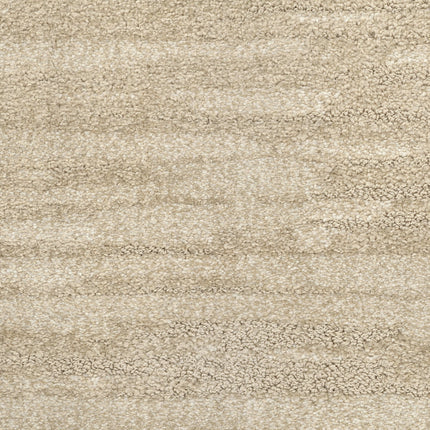 Close-up of Cirrus Berber Carpet in Seashell color, showcasing a soft, plush texture with a subtle wavy pattern for a cozy, luxurious flooring appearance.