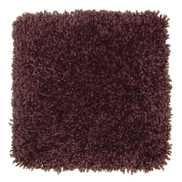 A square sample of Sensible Style III Family Friendly Carpet in Blackberry Wine displays plush, textured, thick shaggy fibers—a modern, comfortable choice—viewed from above on a white background.