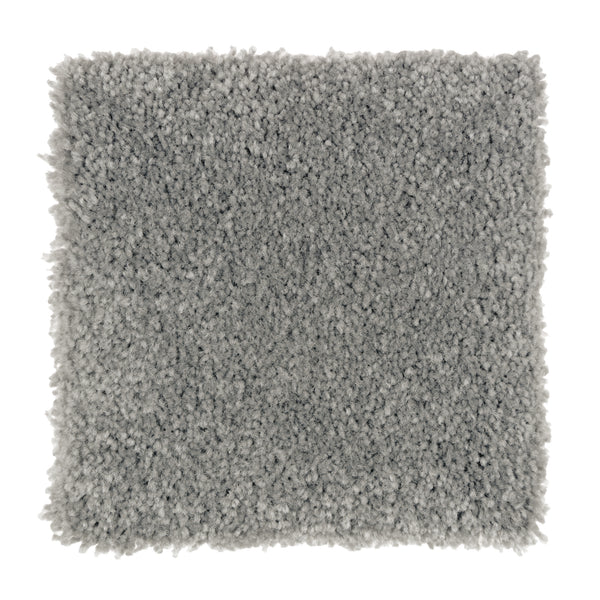 A square sample of Sensible Style III Family Friendly Carpet in Michelangelo, featuring a light gray, plush, textured surface—ideal for everyday comfort and a modern touch to your space. Shown against a white background.