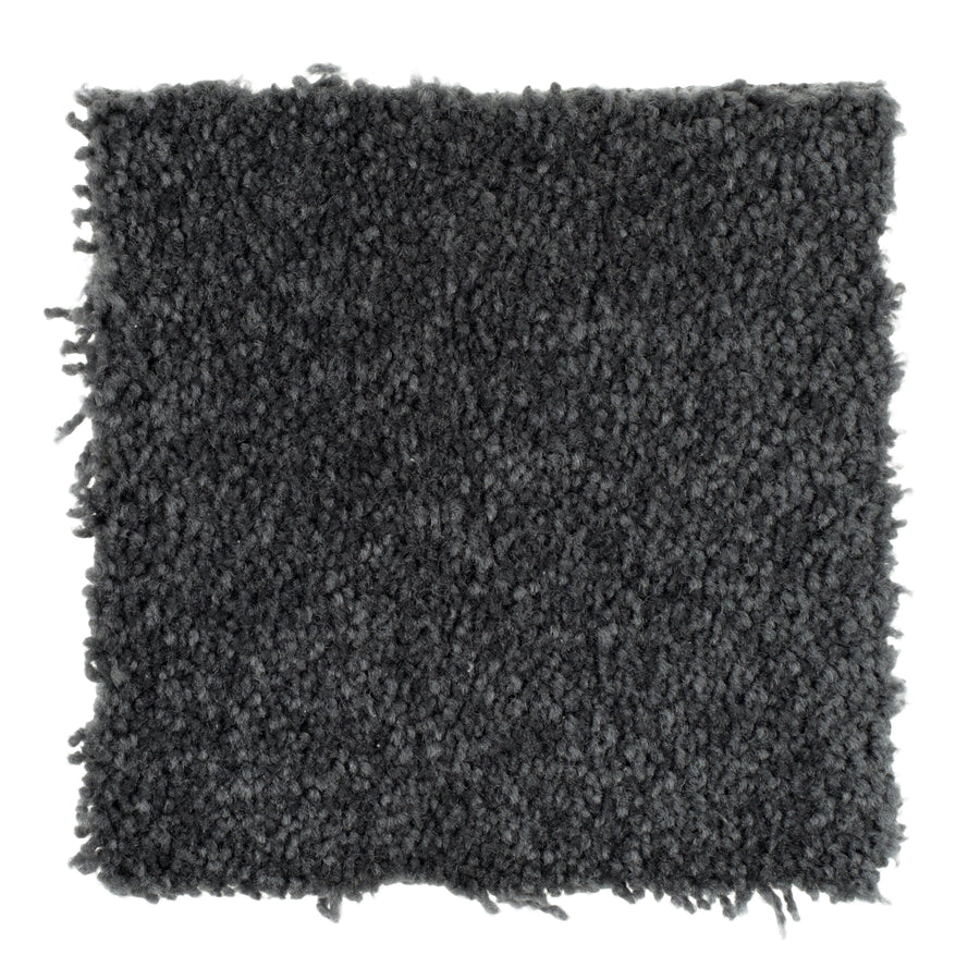 A square sample of Sensible Style III Family Friendly Carpet in Cove Blue features a dark gray textured look with slightly uneven edges on a white background, offering contemporary design and everyday comfort to any space.