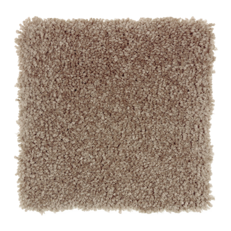 A square sample of Sensible Style III Family Friendly Carpet in Fishers Warf color features plush, textured, thick, and soft light brown fibers for everyday comfort, shown against a white background.