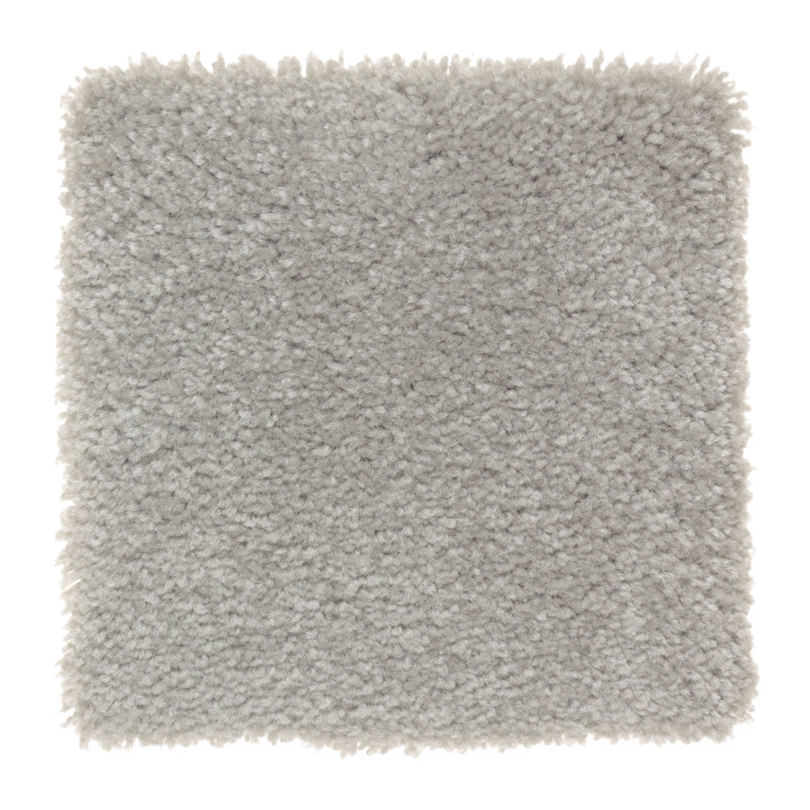 A square sample of Sensible Style III Family Friendly Carpet in Silver Spoon shows its soft, plush, light gray textured surface, photographed from above on a white background for everyday comfort.