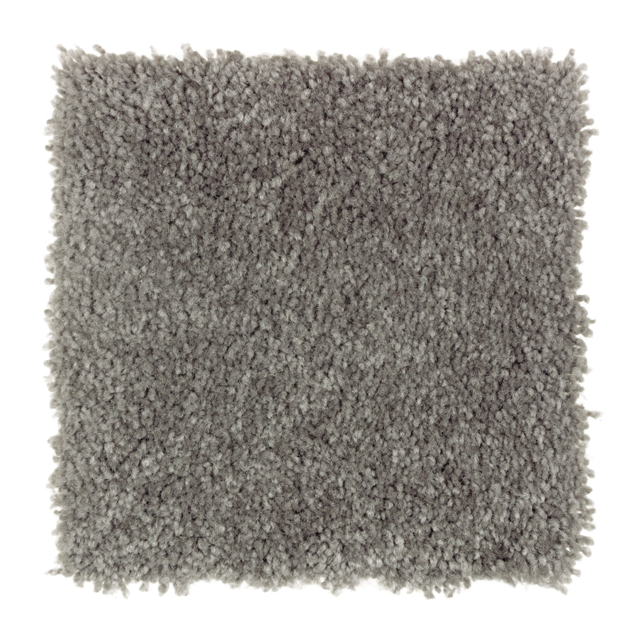 A square sample of Sensible Style III Family Friendly Carpet in British Fog—a light gray, plush, textured, shaggy carpet shown on a white background—ideal for bringing everyday comfort to modern spaces.