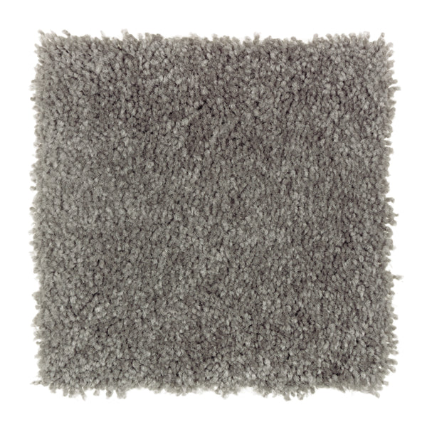 A square sample of Sensible Style III Family Friendly Carpet in British Fog—a light gray, plush, textured, shaggy carpet shown on a white background—ideal for bringing everyday comfort to modern spaces.