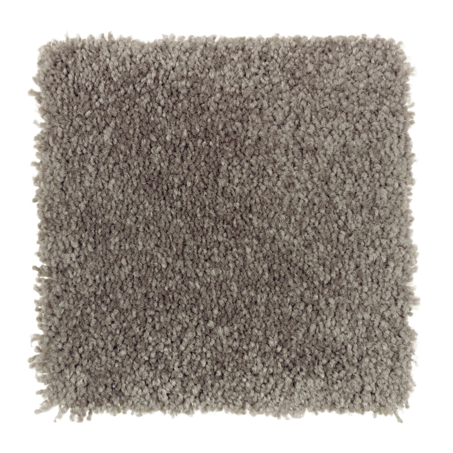 A square sample of Sensible Style III Family Friendly Carpet in Night Phantom shows its light gray, dense, plush shaggy texture that provides everyday comfort and modern appeal, viewed from above on a white background.