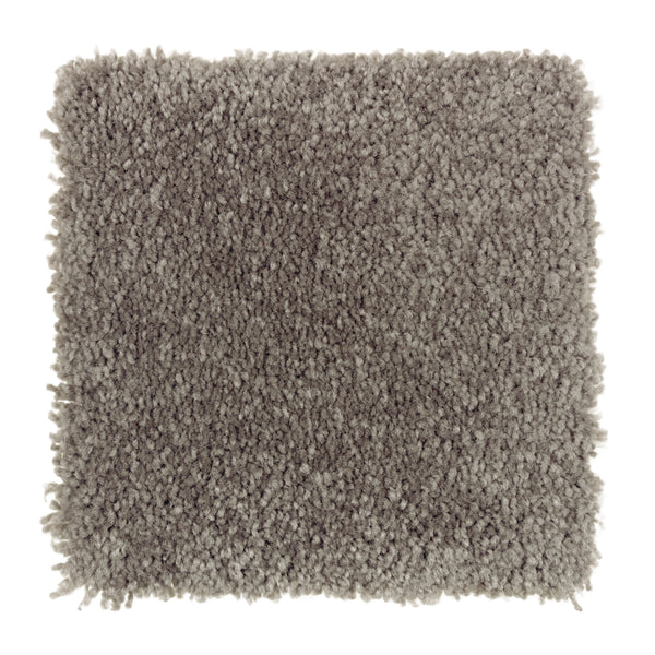A square sample of Sensible Style III Family Friendly Carpet in Night Phantom shows its light gray, dense, plush shaggy texture that provides everyday comfort and modern appeal, viewed from above on a white background.