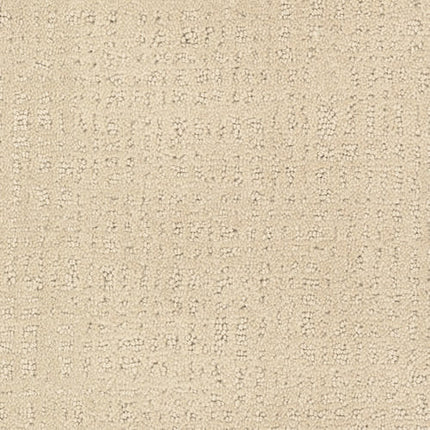 Close-up of Homage Berber Carpet in Serengeti, featuring a beige textured surface with raised dots and squares. Soft and subtly varied in color, this durable carpet is ideal for high-traffic areas needing both style and resilience.