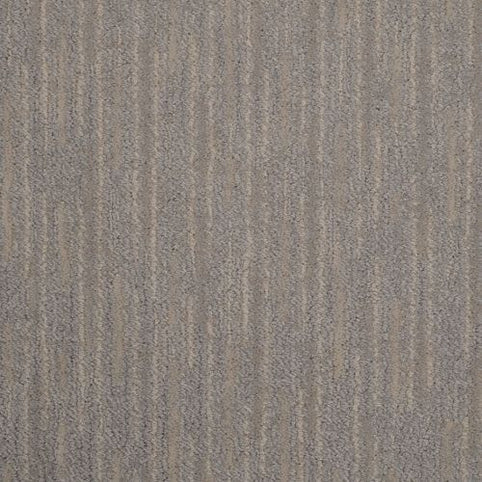 Close-up of Artistic Vision Berber Carpet in Shawdow color, featuring a durable construction and a modern textured pattern of unevenly spaced vertical lines in gray and beige for a subtle, neutral look.
