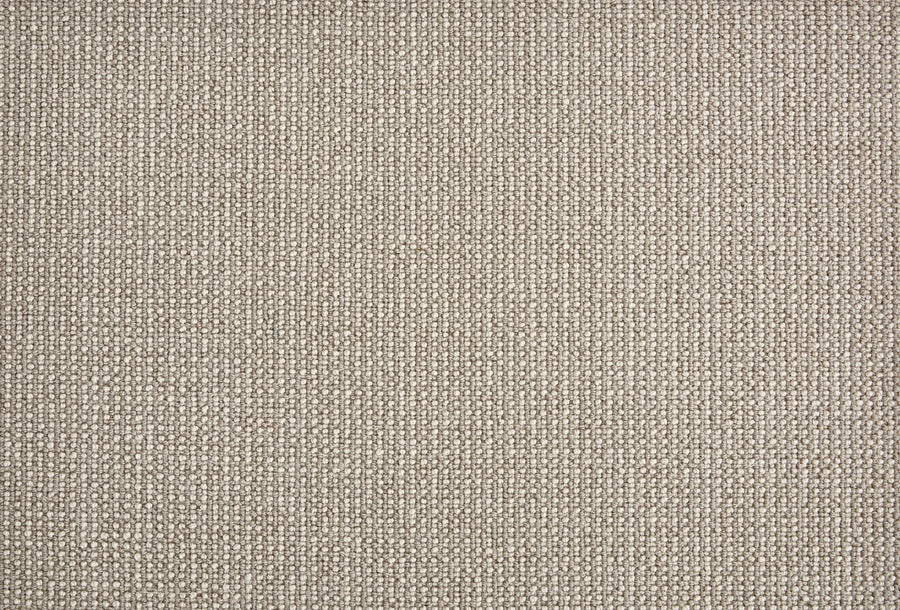 Close-up of Harper Berber Carpet in Shadow color, featuring a tight, woven texture. Its durable, grid-like surface with subtle loops offers timeless style and everyday performance.