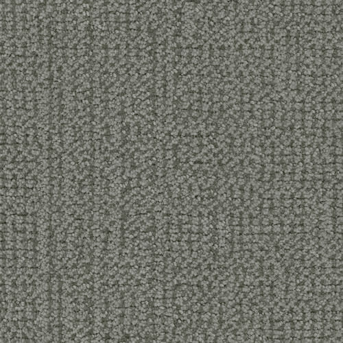 Close-up of the Occasion On Trend Carpet in Showcase color, displaying a textured grey surface with a subtle grid-like pattern and short, tightly woven fibers.