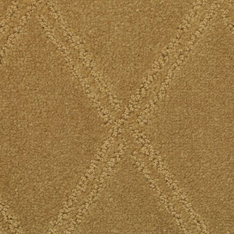 Close-up of Braided Opulence Berber Carpet in Sierra, featuring a tan luxury surface with raised textured diagonal lines intersecting to form an X shape at the center. The plush finish highlights its soft feel and elegant design.