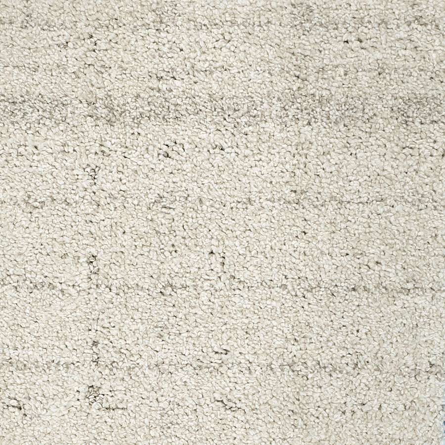 Close-up of the Furry Fun Pet Friendly Carpet in cream, featuring a soft, plush texture with faint horizontal and vertical lines that form a subtle grid pattern. Adds an elegant, cozy touch to any room while being ideal for pets.