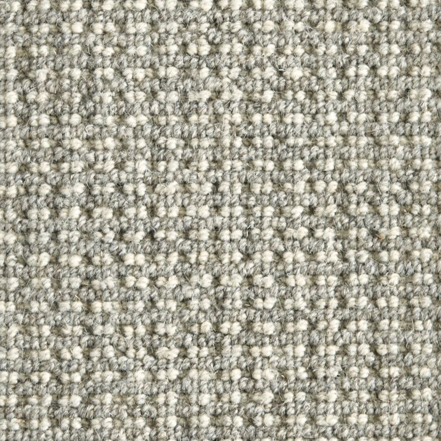 Close-up of Timbers Berber Carpet in Silver, featuring a tightly woven, looped pile with a uniform, grid-like texture—ideal for contemporary style flooring.