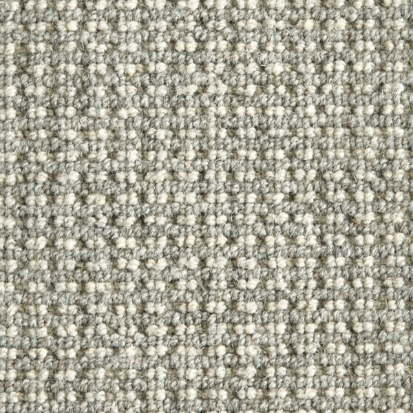 Close-up of Timbers Berber Carpet in Silver, featuring a tightly woven, looped pile with a uniform, grid-like texture—ideal for contemporary style flooring.