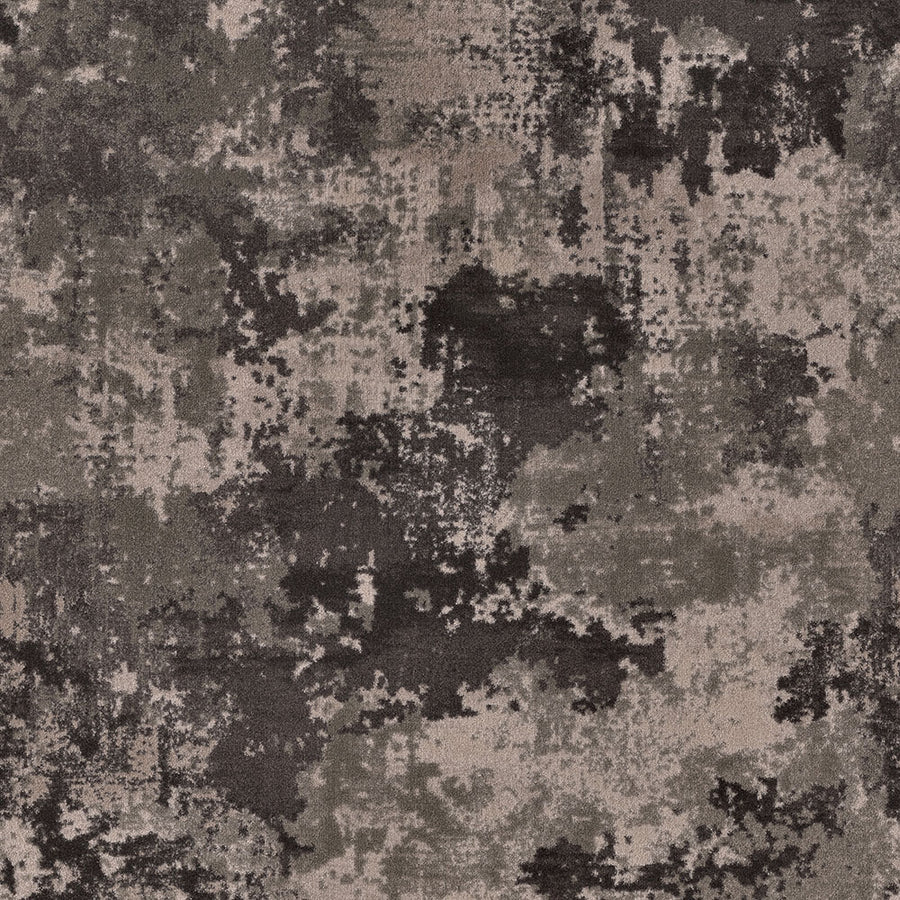 Sky Canvas On Trend Carpet features an abstract pattern in dark gray, black, and taupe, resembling a luxury carpet with camouflage-inspired, blotchy shapes and a richly textured appearance.