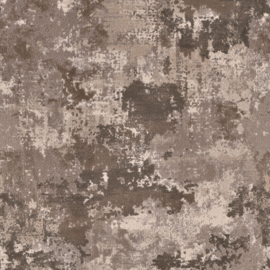 The Sky Canvas On Trend Carpet showcases an abstract pattern with irregular textured patches in brown, beige, and taupe, offering a mottled, camouflage-inspired look ideal for elevating premium interiors.