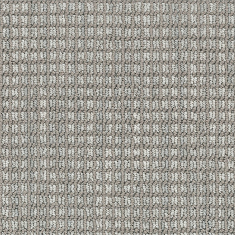 Close-up of Haven Berber Carpet in Skyline color, featuring a durable, stain-resistant surface with a grid-like rectangular weave in shades of grey and beige for a uniform, structured look.