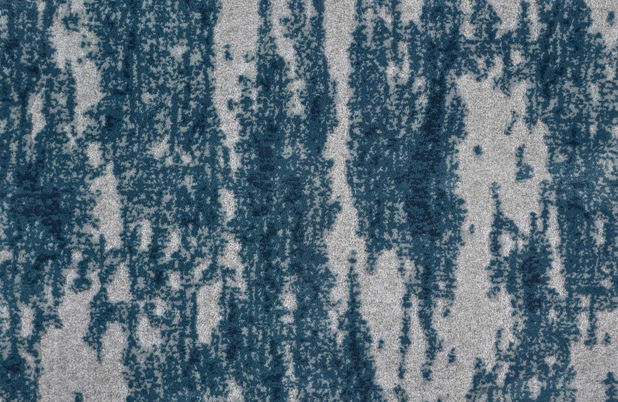 A close-up of Arabella On Trend Carpet in Slate, showcasing its textured, durable surface with an abstract pattern of irregular vertical blue streaks on a light gray background.