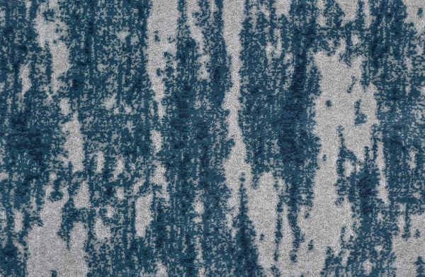 A close-up of Arabella On Trend Carpet in Slate, showcasing its textured, durable surface with an abstract pattern of irregular vertical blue streaks on a light gray background.