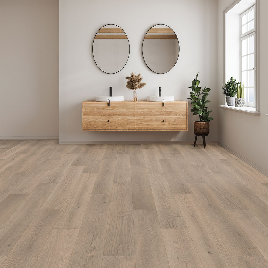 Minimalist bathroom featuring Woodlette Estates 7 1/2" Waterproof Laminate flooring, a floating wooden double-sink vanity, round mirrors, potted plants, and a large window for natural light.