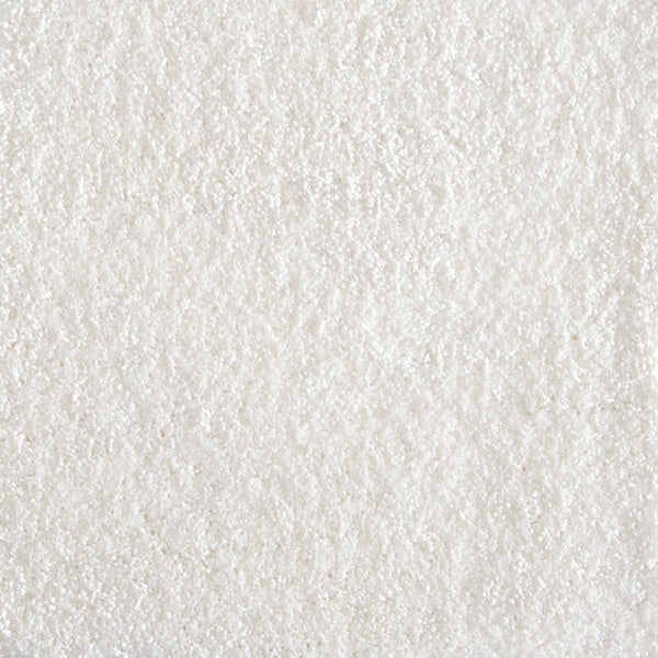 Close-up of Jazzy Family Friendly Carpet in Snow color, featuring a textured, slightly rough surface. Its grainy appearance adds subtle depth and is ideal for high-traffic areas while maintaining an elegant look.