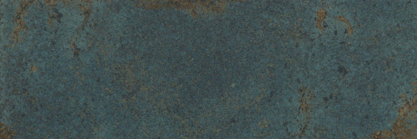Close-up of the Catalyst 4x12 Porcelain Tile in Spark Green, highlighting its striking marbled pattern with weathered textures and subtle color variations brought out by a multi-finish glaze.
