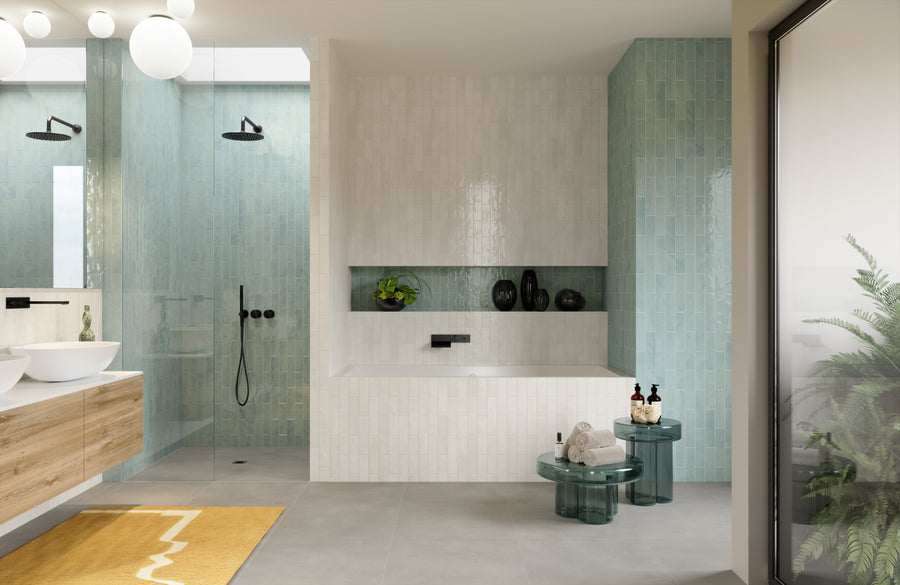 A bathroom with a tub and shower.
