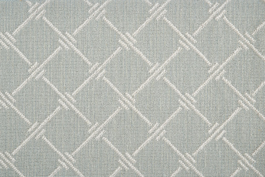 Dalton Berber Carpet in Spring features a light gray textured fabric with a geometric diamond pattern in subtle lighter tones, delivering timeless style that complements elegant flooring.