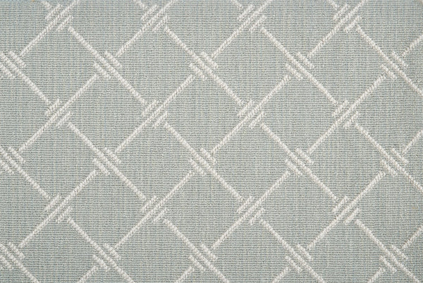 Dalton Berber Carpet in Spring features a light gray textured fabric with a geometric diamond pattern in subtle lighter tones, delivering timeless style that complements elegant flooring.