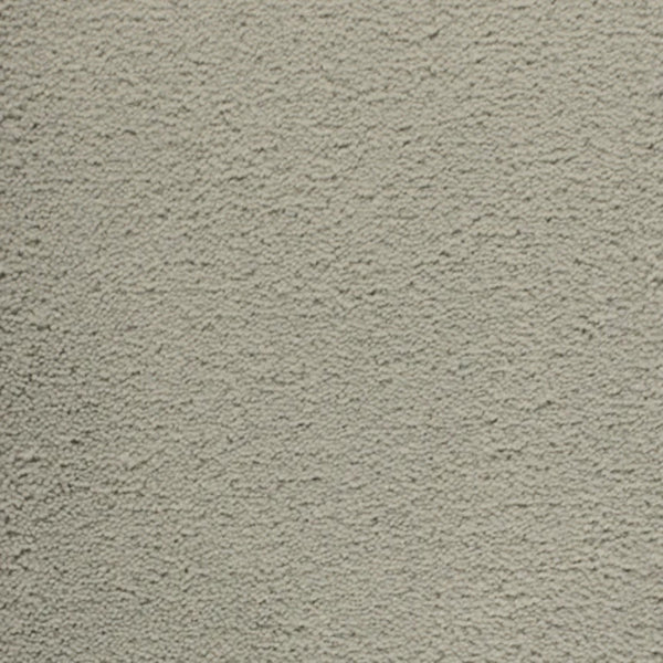 Close-up of Dolce Family Friendly Carpet in Stainless Steel—a light gray, textured surface with a rough, plaster-like finish, ideal for luxury high-traffic spaces.