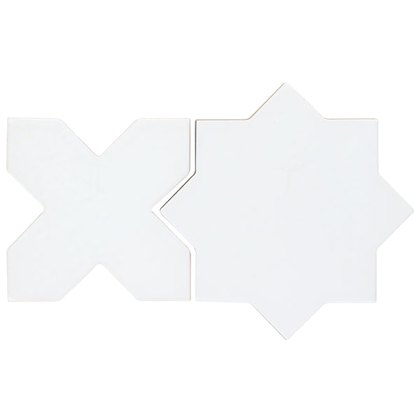 Two white Morocco Star & Cross Porcelain Tiles, one X-shaped and one eight-pointed star, are displayed side by side on a plain background to showcase their striking matte design.