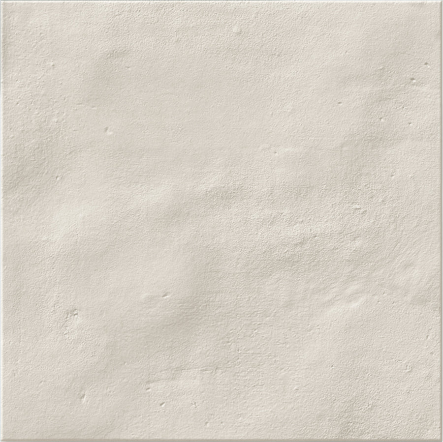 The Stardust 6" x 6" Ceramic Tile in Ivory features a matte, textured surface with subtle bumps for a handcrafted look—perfect for a stylish backsplash or striking accent wall.