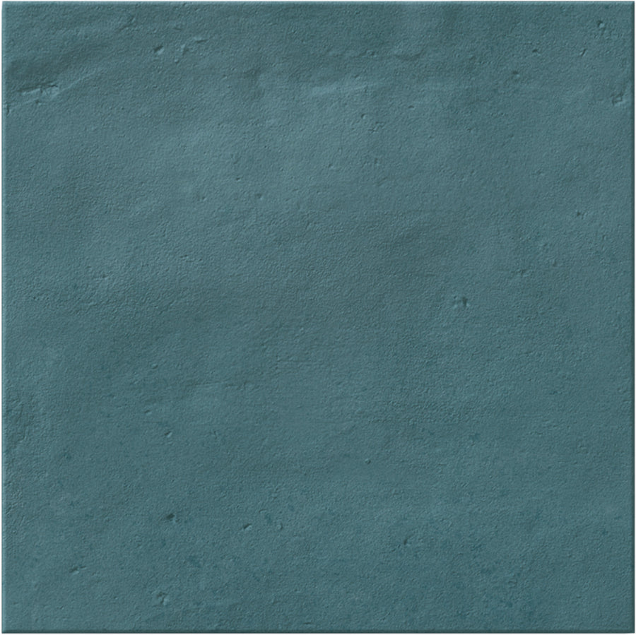 The Stardust 6" x 6" Ceramic Tile in Ocean features a matte teal blue surface with subtle color variations and slight imperfections, ideal for accent walls or backsplashes that evoke the look of painted concrete or plaster.