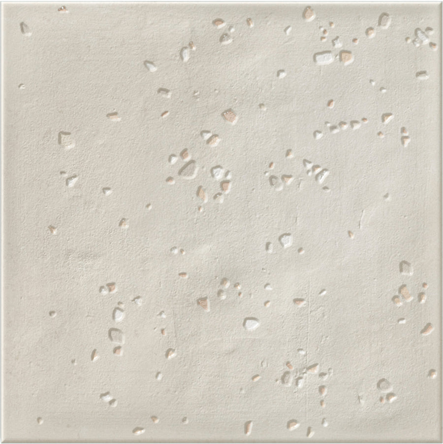 The Stardust Pebbles 6" x 6" Ceramic Tile in Ivory features a matte finish and scattered speckles for a unique, stone-inspired look that adds versatile style to any space.