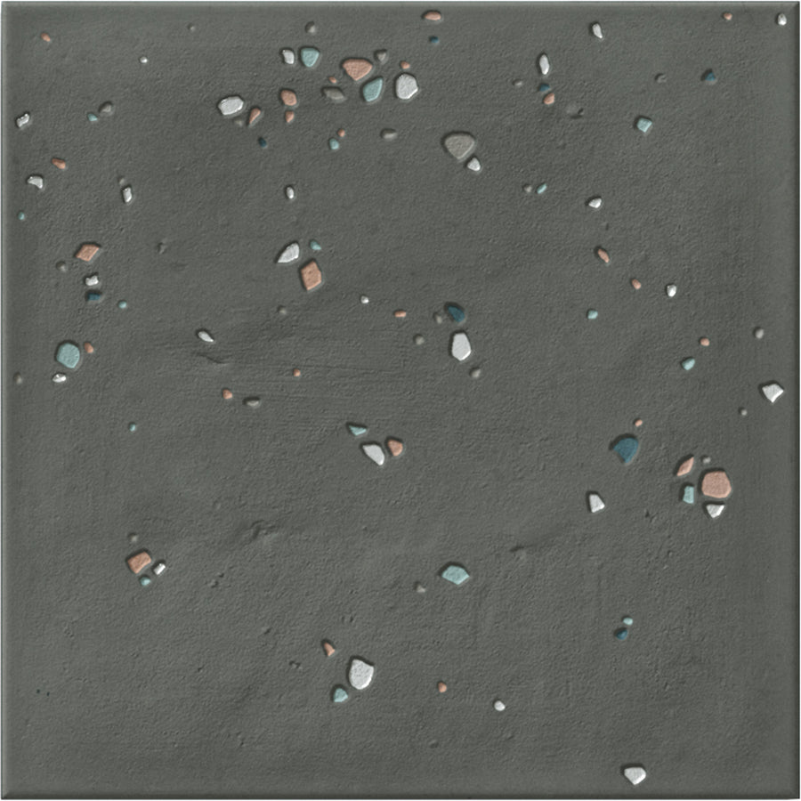 Stardust Pebbles 6" x 6" Ceramic Tile in Nero features a gray, pebbled surface with white, blue, and reddish-brown accents—ideal for accent walls or pairing with other ceramics. The texture is slightly rough and uneven for visual interest.