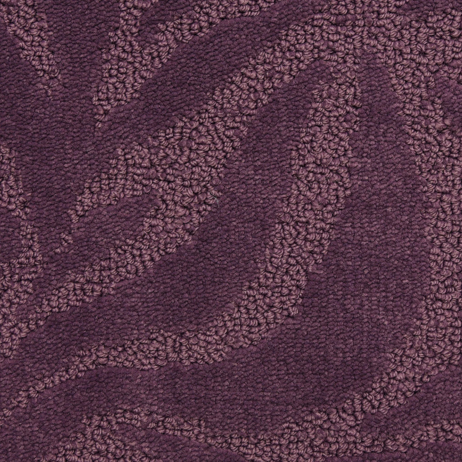 Close-up of Capetown On Trend Carpet in Stellenbosch, featuring a chic textured pattern with raised leafy waves in deep purple. Smooth and looped areas add rich dimension, offering durability and style ideal for high-traffic spaces.
