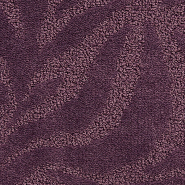 Close-up of Capetown On Trend Carpet in Stellenbosch, featuring a chic textured pattern with raised leafy waves in deep purple. Smooth and looped areas add rich dimension, offering durability and style ideal for high-traffic spaces.