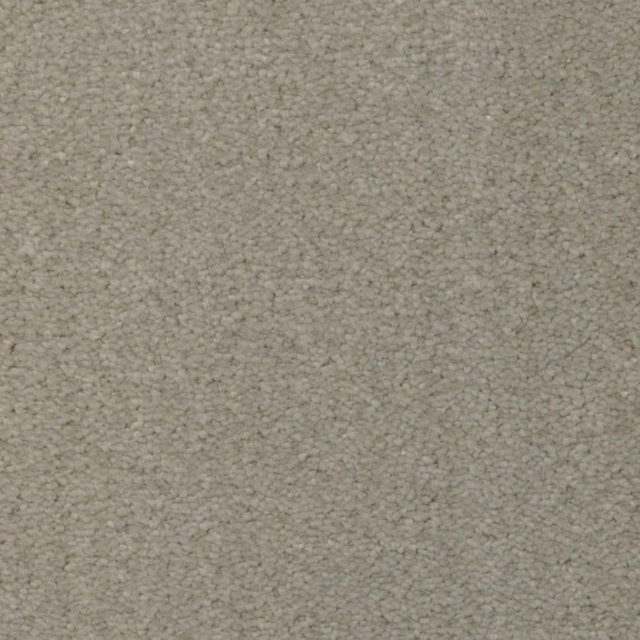 Close-up of Seduction On Trend Carpet in Stepping Stone color, featuring a light beige, textured surface with a tightly woven loop pile. The carpet appears soft and uniform, with subtle shading variations from the fibers.