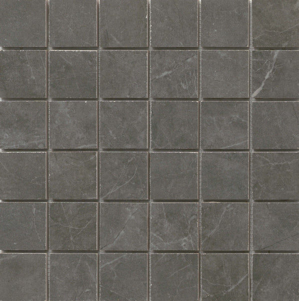 The Callie 2x2 Porcelain Mosaic in Smoke features a grid of dark gray tiles with subtle white veining, separated by thin light gray grout lines for a refined, uniform look.