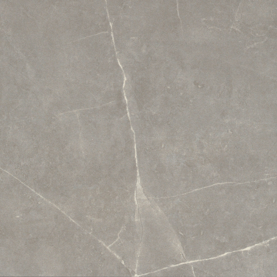 A close-up of the Callie 12x12 Ceramic Tile in Fog, featuring white veins—perfect for designing a luxurious checkerboard pattern.