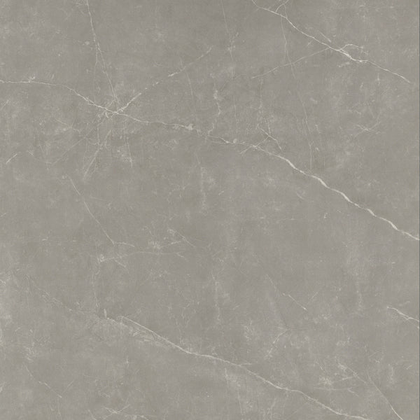 A close-up of the Callie 24x24 Polished Porcelain Tile in Fog shows a smooth gray marble look with subtle white veins and natural diagonal patterns, highlighting the refined elegance of this luxury ceramic tile.
