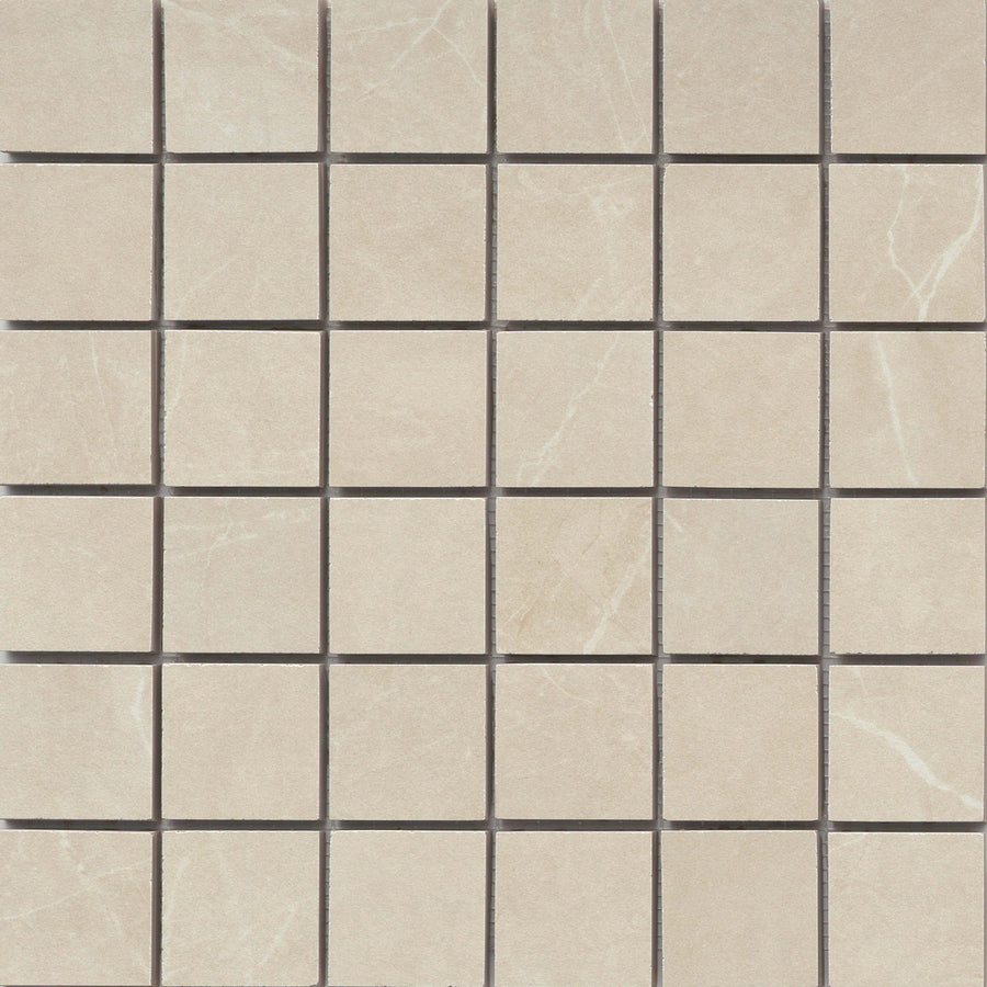 The Callie 2x2 Porcelain Mosaic in Alabaster features a grid of polished beige tiles with subtle white veining and thin dark grout lines, arranged evenly in rows and columns for a refined, checkerboard look.