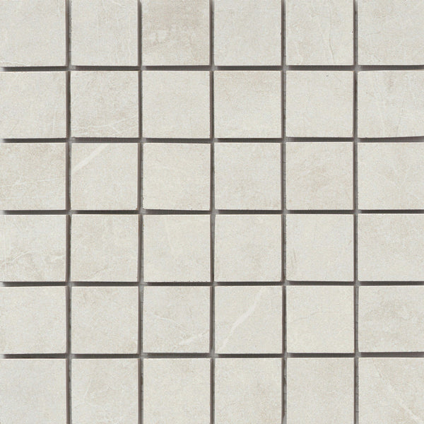 The Callie 2x2 Porcelain Mosaic in Steel features square, light gray tiles with subtle white veining and a smooth, matte finish. They are evenly aligned in a grid pattern and separated by thin dark grout lines.