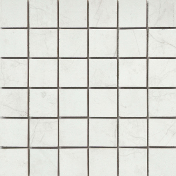 Callie 2x2 Porcelain Mosaic in Snow features square tiles with light gray veining, arranged in a checkerboard pattern and accented by thin dark grout lines for an elegant, luxury ceramic tile effect.