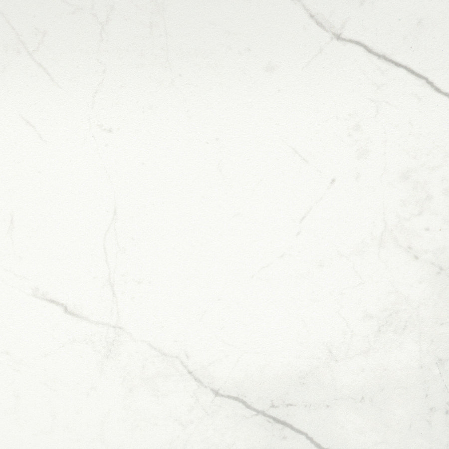 The Callie 12x12 Ceramic Tile in Snow features a white surface with subtle gray veining and smooth texture, capturing natural stone patterns—perfect for achieving a luxurious tile look in any room.