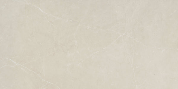 The Callie 12x24 Polished Porcelain Tile in Alabaster features a light beige marble look with soft white and grey veining, delivering a smooth texture and natural stone pattern perfect for elegant interiors.