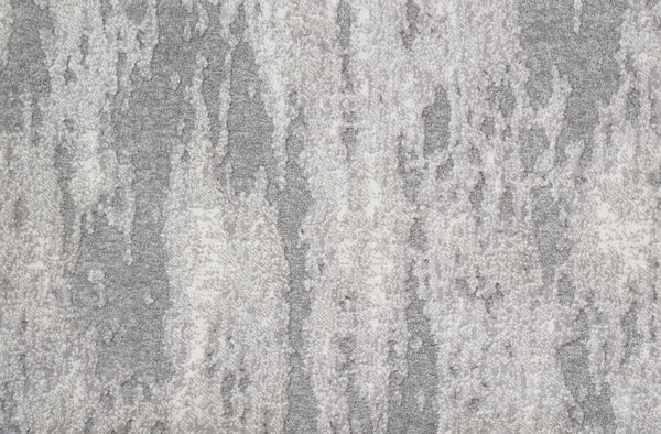 Close-up of Arabella On Trend Carpet in Sterling, showcasing a textured gray and white surface with an irregular, mottled pattern reminiscent of elegant natural stone.