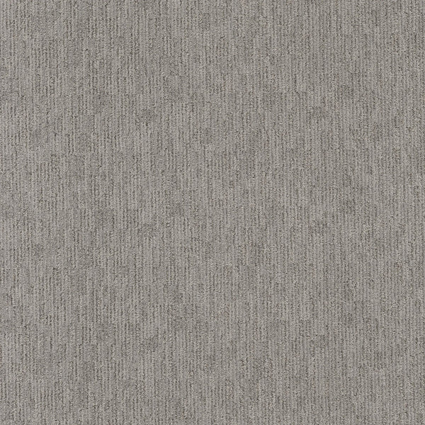 Close-up of Sneak Peak Berber Carpet in Still Gray shows a textured, dense pile with a subtle vertical linear pattern and speckled shades of grey—offering softness and durability for flooring.